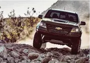  ??  ?? Traction, wheel travel, and obstacle clearance is enhanced over a standard Colorado with a 3.5-inchwider front and rear track, 31-inch Goodyear Duratrac off-road tires on 17-by-8-inch aluminum wheels, and a 2-inch suspension lift.