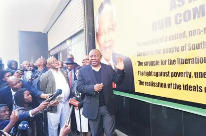  ?? Picture: Nigel Sibanda ?? FORGING AHEAD. Mineral Resources Minister Gwede Mantashe looks on as President Cyril Ramaphosa speaks outside Luthuli House at the unveiling of the Thuma Mina pledge campaign.