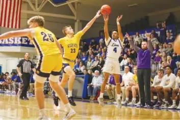  ?? STAFF PHOTO BY OLIVIA ROSS ?? Red Bank's Kamarion Johnson (4) shoots during Red Bank's come-from-behind win over Lawrence County on Monday in the TSSAA Class 3A sectional round at Red Bank.