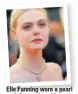  ?? PHOTO: STEPHANE MAHE/REUTERS ?? Elle Fanning wore a pearl and diamond necklace