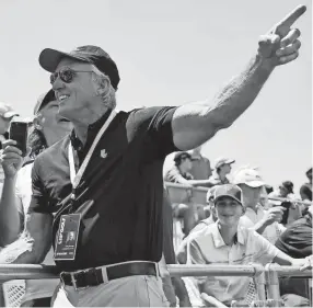  ?? SOOBUM IM/USA TODAY ?? Greg Norman, CEO and commission­er of LIV Golf, talks to fans during the second round of the LIV Golf tournament at Pumpkin Ridge Golf Club.