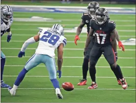  ?? AP - Ron Jenkins ?? Cowboys cornerback C.J. Goodwin (29) follows a Dallas onside kick attempt as the Falcons’ Olamide Zaccheaus looks on during last Sunday’s game.