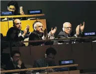  ?? SPENCER PLATT / GETTY IMAGES ?? Members of the Palestinia­n delegation applaud after a vote in which the U.S. declaratio­n of Jerusalem as Israel’s capital was declared “null and void” on Thursday.