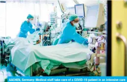  ??  ?? AACHEN, Germany: Medical staff take care of a COVID-19 patient in an intensive care unit at the university hospital of Aachen on April 15, 2020. — AFP