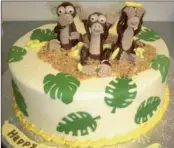  ??  ?? ABOVE and BELOW: Monkey helper, Steve Smit’s birthday cake. RIGHT: Smit with the chicken, Karooster, he was gathering when he nearly lost his right eye, by walking into a stick at his Westville home. Smit is back home after undergoing surgery to his...
