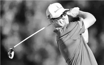  ??  ?? Zach Johnson of the United States plays his shot from the 16th tee during round one of the Sony Open In Hawaii at Waialae Country Club on January 11, 2018 in Honolulu, Hawaii. - AFP photo