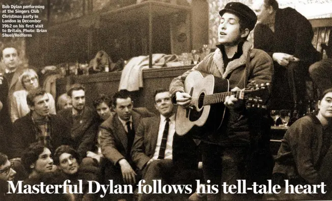  ??  ?? Bob Dylan performing at the Singers Club Christmas party in London in December 1962 on his first visit to Britain. Photo: Brian Shuel/Redferns