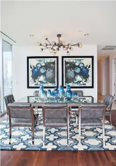  ??  ?? Comfort is just as important as beauty when choosing dining room seating, says Abbe Fenimore, founder of the design firm Studio Ten 25, who chose sleek but softly padded chairs for the dining room shown here.