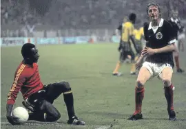  ?? Picture: SNS. ?? Denis Law is beaten to the ball by Zaire goalkeeper Muamba Kazadi during the 1974 World Cup.
