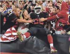  ?? KIRBY LEE, USA TODAY SPORTS ?? 49ers running back Carlos Hyde celebrates with fans in the fourth quarter Monday after scoring his second touchdown.