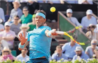  ?? ALESSANDRA TARANTINO/ASSOCIATED PRESS ?? Rafael Nadal makes a return to Juan Martin del Potro during their French Open semifinal Friday in Paris. Nadal advanced in straight sets.