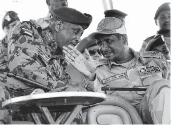  ?? Associated Press ?? Gen. Mohamed Hamdan Dagalo, right, of Sudan’s military council called Saturday for an interim government to be formed to run the country until elections are held.
