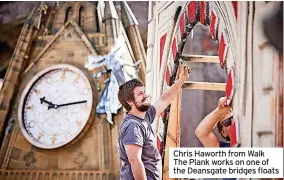  ?? ?? Chris Haworth from Walk The Plank works on one of the Deansgate bridges floats