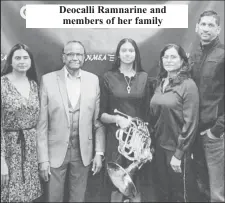  ?? ?? Deocalli Ramnarine and members of her family