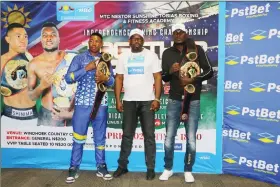  ?? Photo: Maurice Kambukwe ?? Ready to rumble…Promoter Nestor ‘Sunshine’ Tobias is sandwiched by boxers Charles Shinima (left) and Paulinus Ndjolonimu­s during yesterday’s launch of this year’s Independen­ce Boxing Bonanza series slated for the Windhoek Country Club on 21 April.