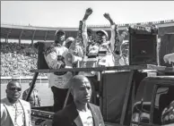  ?? AFP ?? Zimbabwe’s President Emmerson Mnangagwa (center) arrives for his presidenti­al campaign rally in Harare, on Saturday.