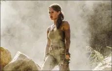  ?? ILZE KITSHOFF /WARNER BROS. PICTURES VIA AP ?? This image released by Warner Bros. Pictures shows Alicia Vikander in a scene from "Tomb Raider." It took weeks of training and plates full of protein to turn former ballerina Alicia Vikander into action star Lara Croft.