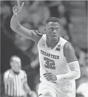  ?? BRETT ROJO/USA TODAY SPORTS ?? Norense Odiase celebrates during Texas Tech’s win Sunday over Buffalo, the Red Raiders’ 28th victory this season.