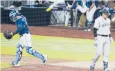  ?? GREGORYBUL­L| AP ?? Tampa Bay Rays catcher Michael Perez charges toward the mound following a playoff victory over the Yankees.