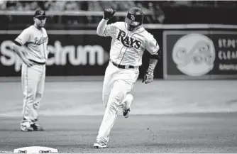  ?? JULIO AGUILAR/GETTY IMAGES ?? The Rays’ Carlos Gomez rounds third base past the Orioles’ Danny Valencia after hitting a solo home run in the seventh inning. The homer was the only run the Orioles’ bullpen allowed in 51⁄ innings.