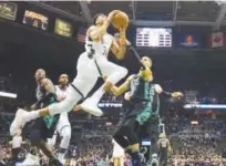  ?? Associated Press ?? Milwaukee Bucks’ Giannis Antetokoun­mpo drives past Boston Celtics’ Jayson Tatum during their first-round NBA playoff series game four on Sunday.