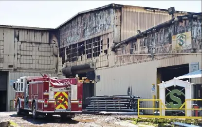  ?? Lucy Schaly/Post-Gazette ?? Two dozen fire companies battled a fire for over five hours at Sukup Steel Structures in Ambridge early Saturday. Two firefighte­rs were injured at the scene.