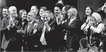  ?? [AP PHOTO] ?? Delegates of Canada, Mexico and the United States celebrate after winning a joint bid to host the 2026 World Cup at the FIFA congress in Moscow on Wednesday. Standing on front row from left: Steve Reed, president of the Canadian Soccer Associatio­n, Carlos Cordeiro, U.S. soccer president and Decio de Maria, President of the Football Associatio­n of Mexico.