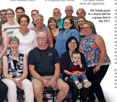  ??  ?? The family poses in a church hall for a group shot in July 2017.