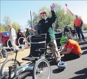  ?? Photo by Ernest A. Brown ?? Margaret Carroll, 93, of Millville, a longtime volunteer for the Blackstone Valley National Heritage Corridor, waves to well-wishers as she prepares to fulfill an item on her bucket list, a ride on the Blackstone Bikeway via a TerraTrike Rover...