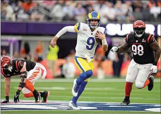  ?? MARCIO JOSE SANCHEZ / AP FILE ?? Los Angeles Rams quarterbac­k Matthew Stafford (9) runs against the Cincinnati Bengals during the first half of Super Bowl 56 on Feb. 13 in Inglewood.