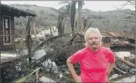  ??  ?? Sir Richard Branson in front of the damage on his private island Necker.