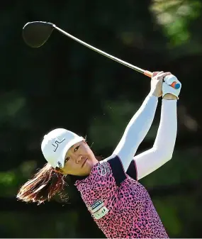  ??  ?? Off it goes: Kelly Tan watches her shot from the 13th tee during the second round of the Women’s PGA Championsh­ip at Aronimink Golf Club. — AFP