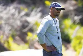  ?? K.C. ALFRED U-T ?? University of San Diego head football coach Brandon Moore looks on during practice earlier this week. Moore is the 14th coach in USD history.