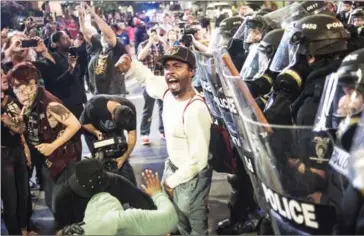  ?? SEAN RAYFORD/GETTY IMAGES/AFP ?? The North Carolina governor has declared a state of emergency in the city of Charlotte after clashes during protests in response to the fatal shooting by police of Keith Lamont Scott.