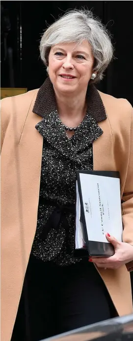  ??  ?? British Prime Minister Theresa May leaves 10 Downing Street in London ahead of a statement to MPs on last week’s European Council meeting