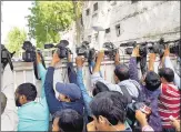  ?? PTI ?? Media persons outside the CBI office in Lucknow on Friday after BJP MLA Kuldeep Singh was brought in for questionin­g in connection with the Unnao rape case. He was later arrested.