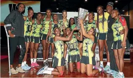  ??  ?? Jamaica players with the Taini Jamison Trophy after beating the Silver Ferns in the final.