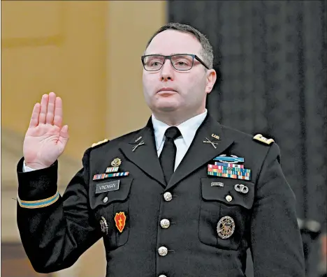  ?? ANDREW CABALLERO-REYNOLDS/GETTY-AFP 2019 ?? Lt. Col. Alexander Vindman is sworn in Nov. 19 at a House hearing in President Trump’s impeachmen­t case. Vindman’s attorney said the decorated Iraq War veteran is retiring.