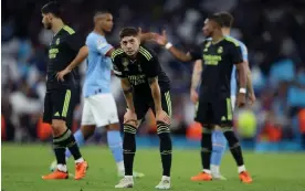  ?? Photograph: David Rawcliffe/EPA ?? Federico Valverde looks to the sky after Real Madrid’s humbling Champions League exit to Manchester City.