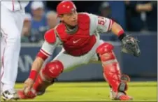  ?? THE ASSOCIATED PRESS FILE ?? Carlos Ruiz wanted to play his entire career with the Phillies, but those plans changed when the fan favorite was traded Thursday to the Dodgers. Phils GM Matt Klentak said the move was made to give ‘Chooch’ a chance to chase another World Series ring.