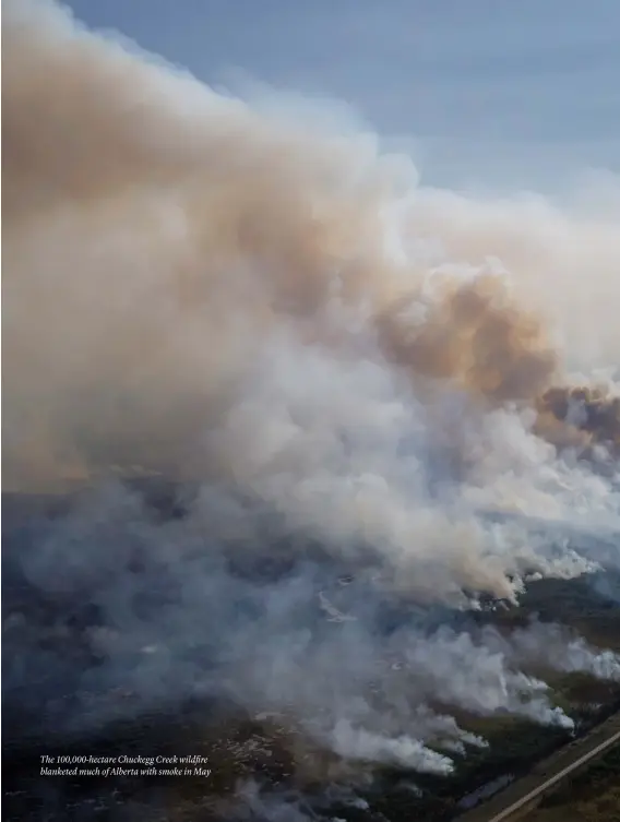  ??  ?? The 100,000-hectare Chuckegg Creek wildfire blanketed much of Alberta with smoke in May