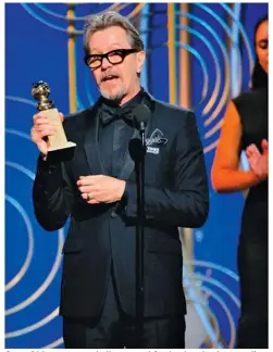  ??  ?? Gary Oldman accepts the award for best actor in a motion picture drama for his role in “The Darkest Hour.”