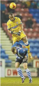  ?? AP FILE PHOTO ?? NEW FACE: Claude Dielna — leaping for a header during his time at Sheffield Wednesday — signed with the Revs on July 28.