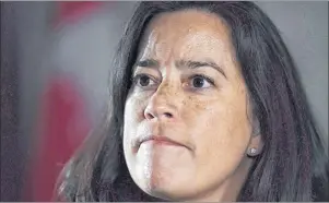  ?? CP PHOTO ?? Minister of Justice and Attorney General of Canada Jody Wilson-Raybould listens to a question as she speaks to reporters following Question Period in the House of Commons on Parliament Hill in Ottawa on Feb. 7, 2018. Wilson-Raybould says the federal...