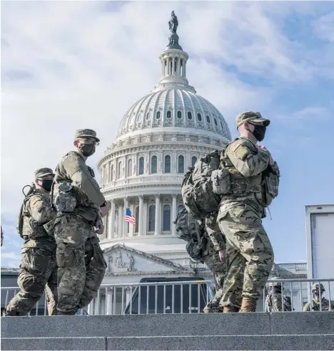 ?? Photo / AP ?? National Guard troops reinforce security around the Capitol ahead of Presidente­lect Joe Biden's inaugurati­on.