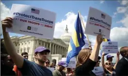  ?? JUSTIN SULLIVAN, GETTY IMAGES ?? LGBT rights supporters protest a ban on transgende­red servicemem­bers in Washington, D.C.