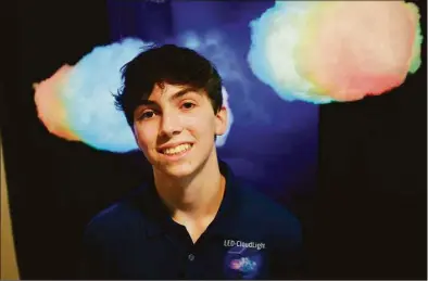  ?? Brian A. Pounds/Hearst Connecticu­t Media ?? Staples High junior Aiden Schachter, 16, has been growing his home business, LED Cloud Light, for three years in Westport. Schacter will be selling colorful cloud lights at Craft Westport on November 5-6 at Staple High School.