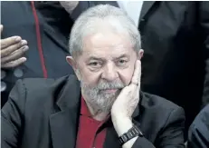  ?? MIGUEL SCHINCARIO­L/GETTY IMAGES ?? Former Brazilian president Luiz Inacio Lula Da Silva says the judgment and prison sentence against him for corruption was aimed at preventing him from running for president again.