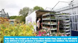  ?? —AFP ?? Peter Kemp, the youngest son of Nursery Owner Royden Kemp, loads a lorry with plants to be delivered to local gardeners at Sandiacre Nursery near Guildford. The nursery is a third generation family-owned business.