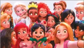  ?? Associated Press photo ?? This image released by Disney shows the character Vanellope von Schweetz, voiced by Sarah Silverman,foreground centre, posing for a selfie with Disney princesses in a scene from “Ralph Breaks the Internet.” Filmmakers invited the original voice talent to return to the studio to help bring their characters to life.